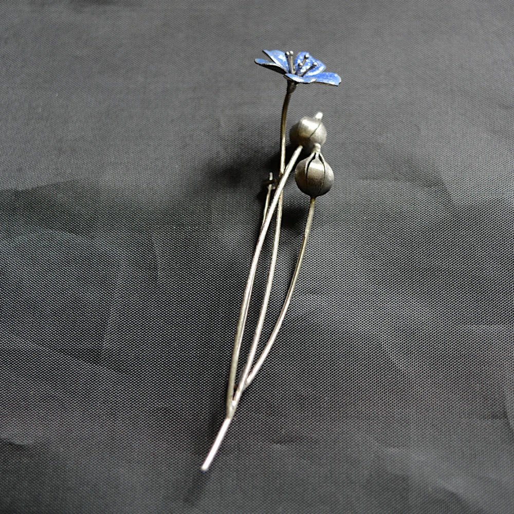 Brož - rozkvetlý Len s tobolkami